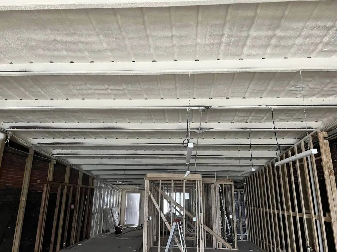 Spray foam applied to a wall assembly